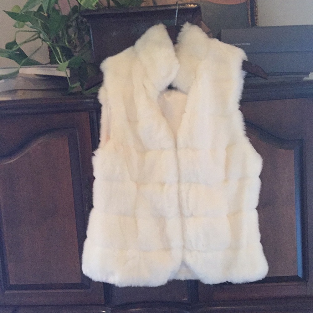 Winter white faux fur vest. Never worn.